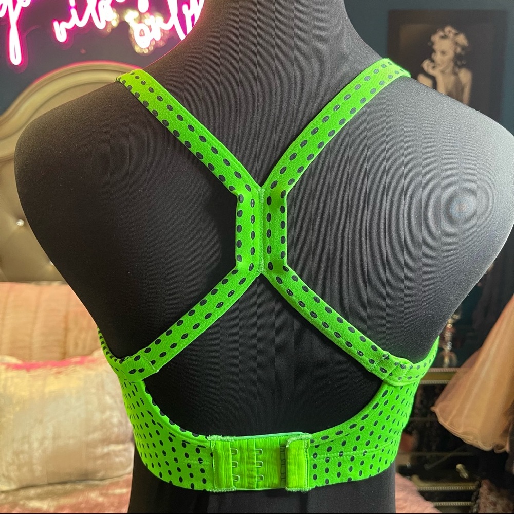 VICTORIAS SECRET VSX Sports Bra in Green w/lack polka dots. Size 34D